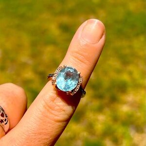 LeVian blue topaz ring with diamond accents in rose gold. Size 7.